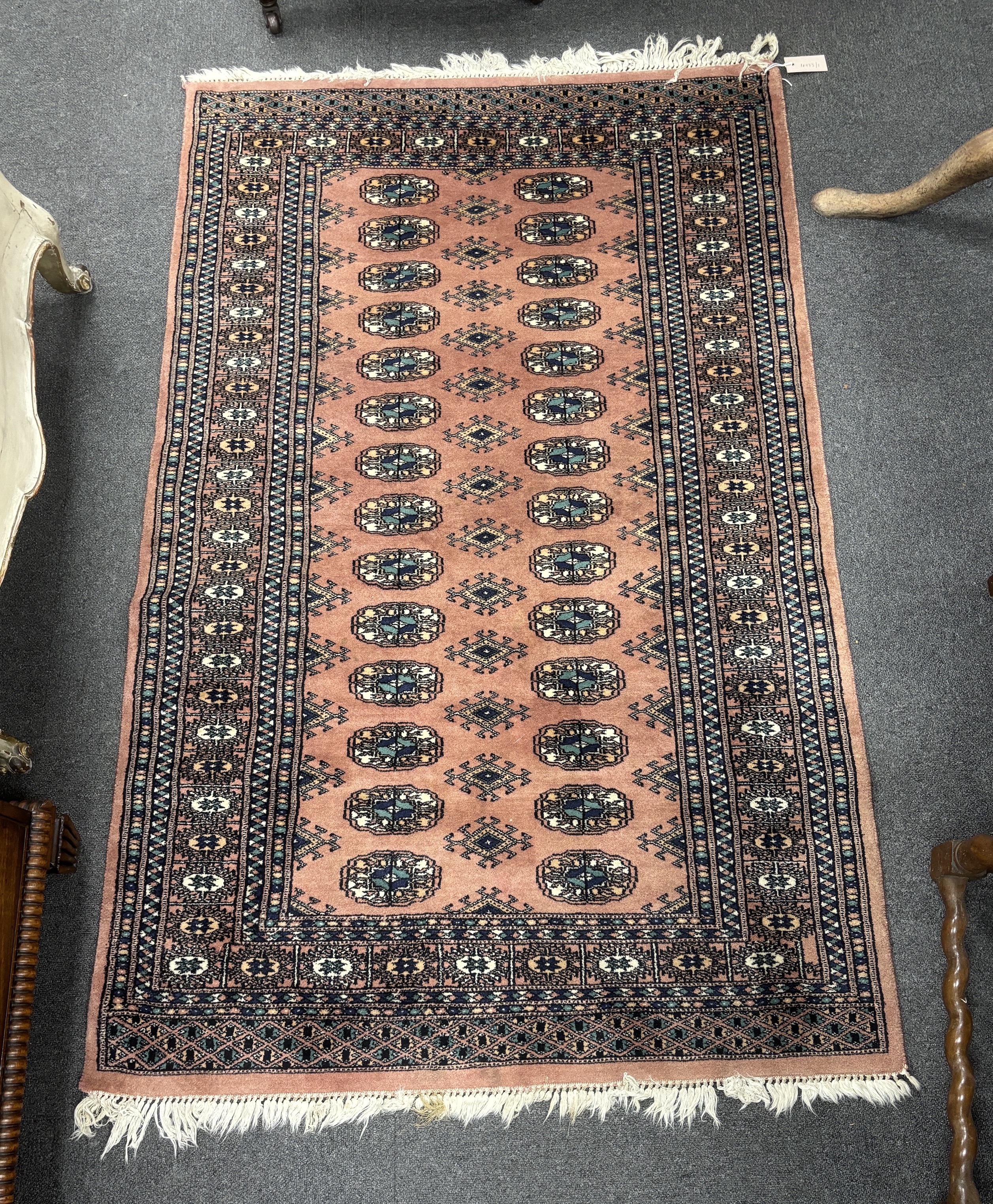 A Bokhara peach ground rug, 164 x 102cm